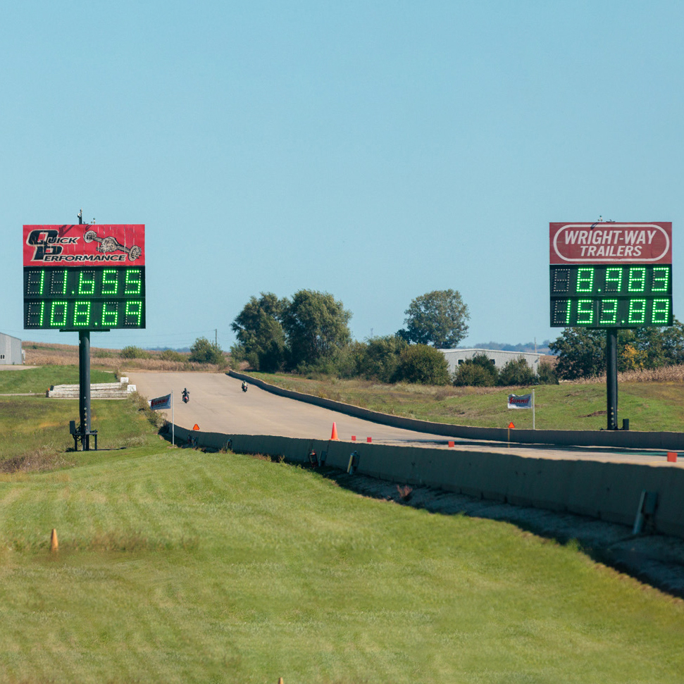 Drag racing track and scoreboards